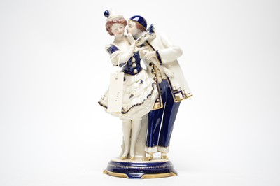 Lot 394 - A Royal Dux Vienna ceramic figure group of a couple.