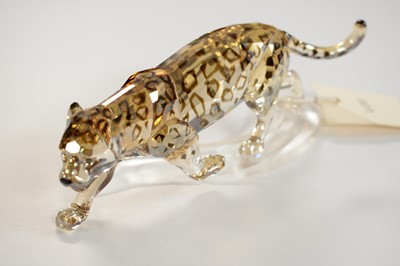 Lot 399 - A Swarovski Crystal figure of a jaguar.