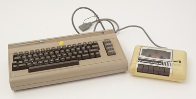 Lot 271 - A Commodore 64 home computer, with a cassette player and a selection of cassette games.