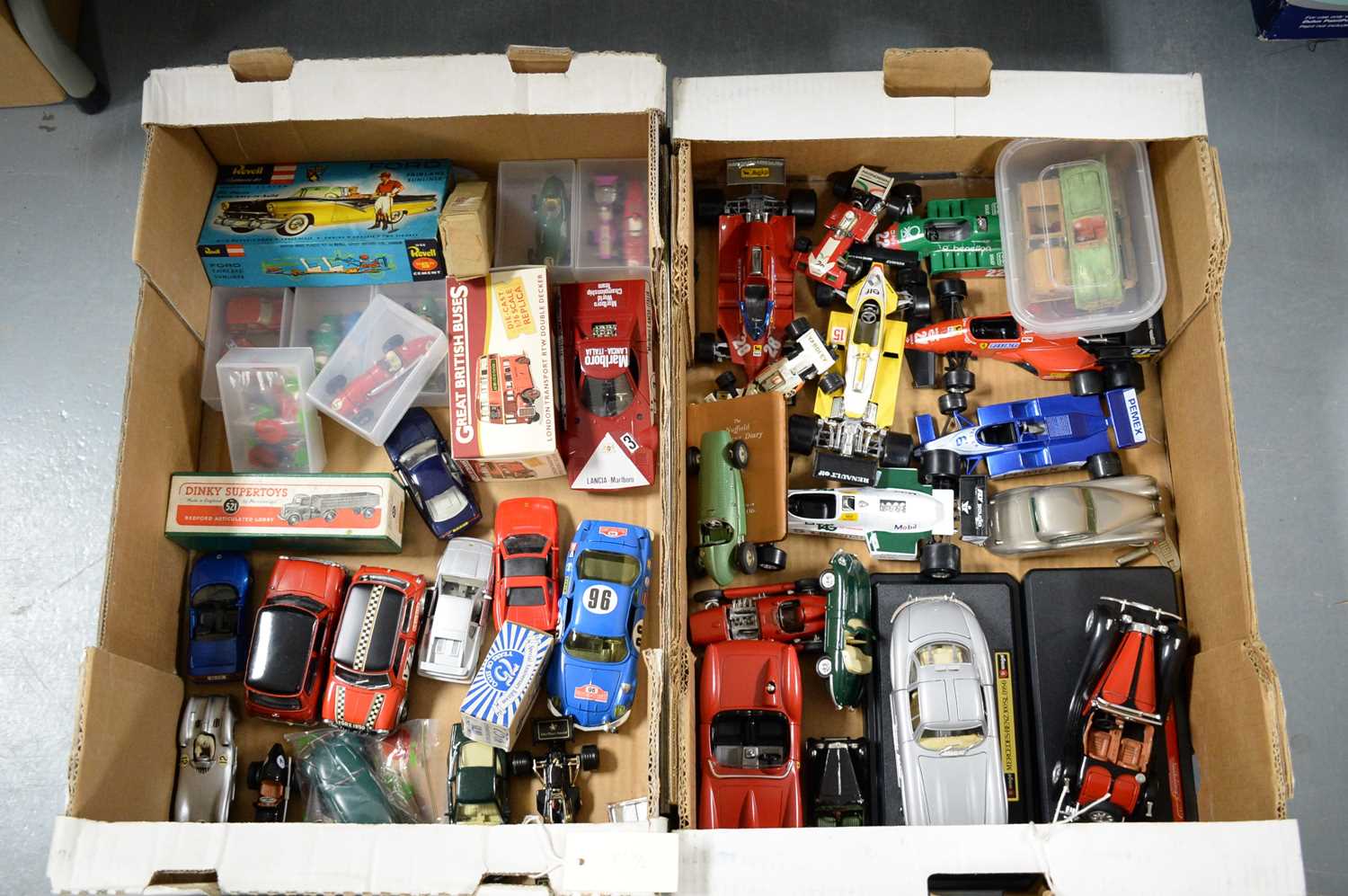 Lot 516 - A selection of diecast model racing cars, buses, etc