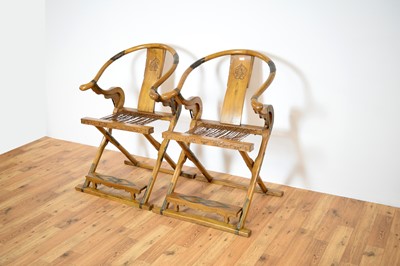 Lot 3 - A pair of Chinese hardwood and metal mounted folding hunting chairs