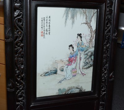 Lot 858 - A set of four Chinese oriental decorative ebonised hardwood and porcelain panels