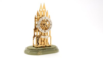 Lot 1263 - A brass skeleton cathedral mantel clock by Elliott of London