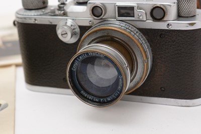 Lot 397 - A Leica IIIa rangefinder camera; and accessories