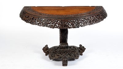 Lot 1328 - A 19th Century Anglo Indian carved demi lune table