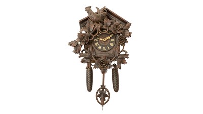 Lot 1265 - A Swiss carved oak cuckoo wall clock, late 19th century