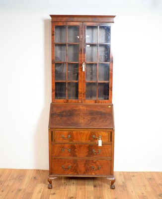 Lot 18 - An early 20th Century mahogany bureau bookcase by Harrods of London