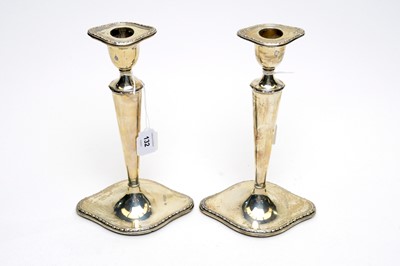 Lot 132 - A pair of silver candlesticks