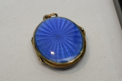 Lot 156 - Silver enamel pendant and gold mount locket.