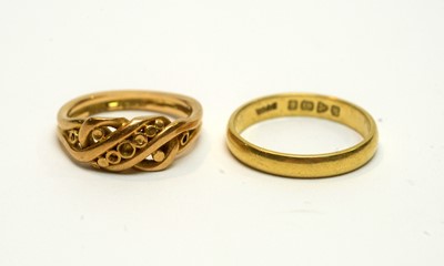 Lot 166 - An 18ct yellow gold wedding band, and an 18ct yellow gold knot pattern ring