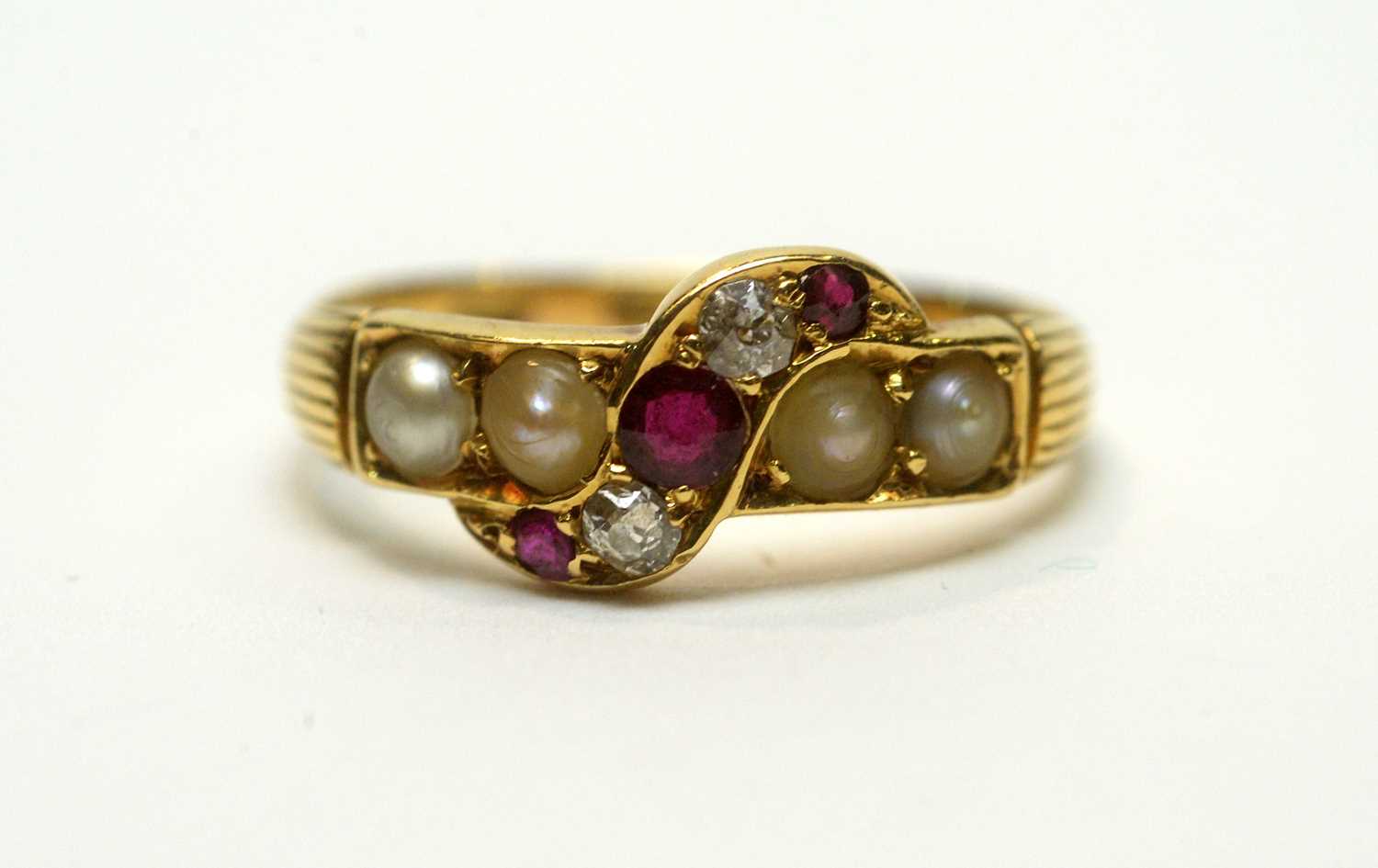 Lot 208 - A ruby, diamond, and pearl ring