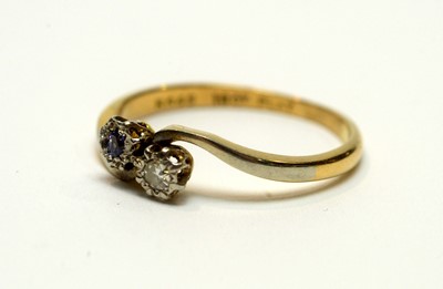 Lot 211 - A sapphire and diamond ring and another
