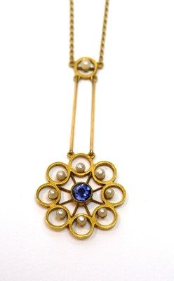 Lot 217 - An Edwardian sapphire and seed pearl pendant