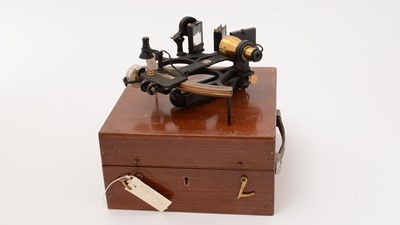 Lot 184 - A 1940's brass and ebonised metal Husun Sextant by Henry Hughes & Son