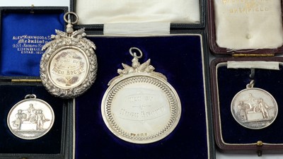 Lot 277 - Two George V silver ploughing medals