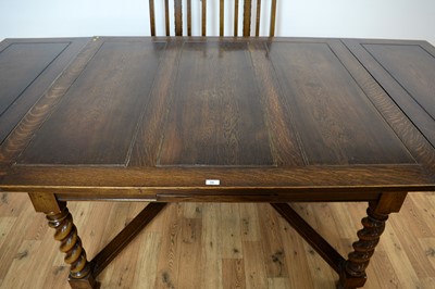 Lot 69 - A 20th Century Jacobean revival oak dining suite
