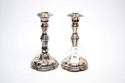 Lot 287 - A pair of silver candlesticks