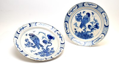 Lot 890 - Pair Dutch Delft parrot chargers