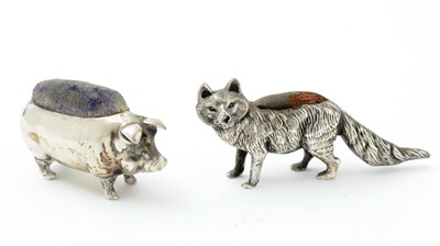Lot 300 - An Edwardian silver novelty pincushion and another silver example in the form of a pig