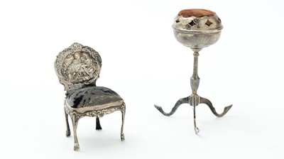 Lot 310 - An Edwardian silver novelty pincushion and a silver pincushion