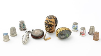 Lot 313 - ﻿﻿Two enamel silver thimbles and other thimbles, Victorian tape measures and other items