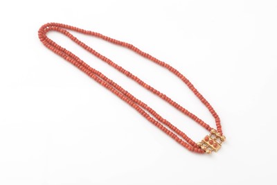 Lot 405 - A two strand coral necklace