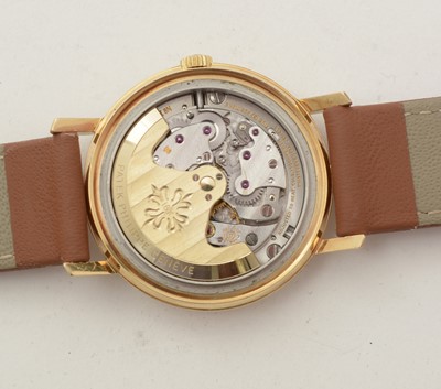 Lot 613 - Patek Philippe, Geneve: an 18ct yellow gold-cased automatic wristwatch