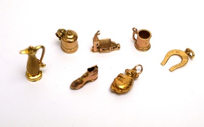 Lot 101 - A selection of 9ct yellow gold charms