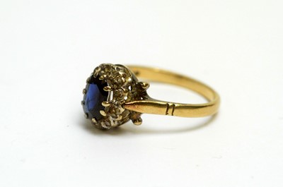 Lot 104 - Two sapphire and diamond cluster rings, and a nine-stone sapphire ring