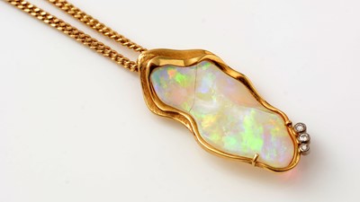 Lot 425 - An opal and diamond pendant