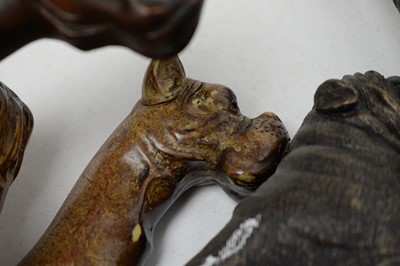 Lot 462 - A selection of 20th Century walking sticks, each with bulldog head handle, most carved
