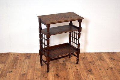 Lot 23 - A 20th Century oak reading table in the manner of Leonard Wyburn for Liberty