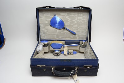 Lot 290 - A Mappin & Webb Art Deco silver and enamel dressing table set.