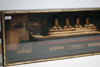 Lot 266 - A Titanic commemorative maritime display case, containing a half block style model ship