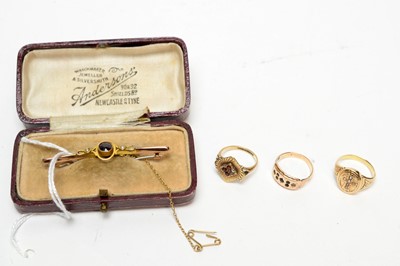 Lot 189 - A garnet and seed pearl bar brooch; a 9ct yellow gold and ruby ring; and a 9ct rose gold ring