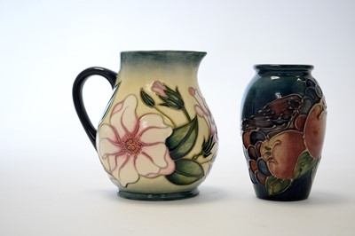 Lot 162 - Two small Moorcroft vases and a jug.