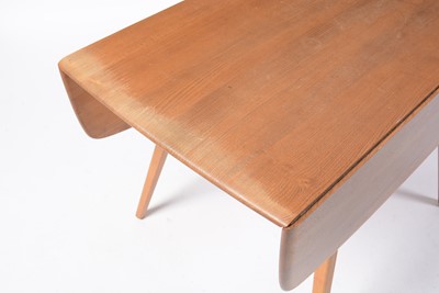 Lot 75 - Ercol - Lucian Ercolani - A retro vintage mid 20th Century Circa 1960s drop leaf dining table