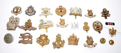 Lot 1021 - A selection of mostly First World War cap badges