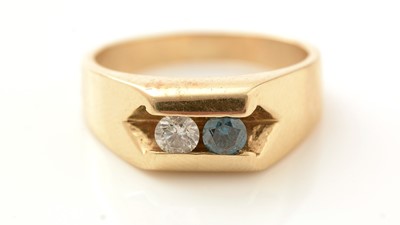 Lot 548 - A two stone diamond and blue coloured diamond ring
