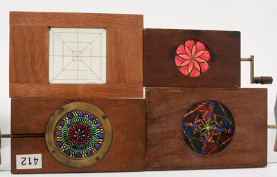 Lot 15 - A collection of five mechanical mahogany framed Chromatrope Magic Lantern slides