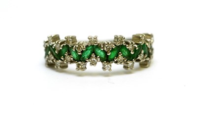 Lot 112 - An emerald and diamond ring