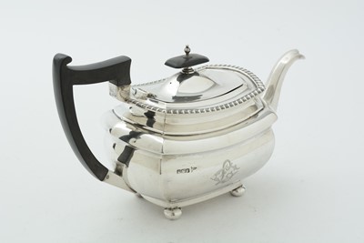 Lot 52 - An Edwardian three piece silver tea set and matching coffee pot