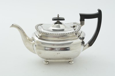 Lot 52 - An Edwardian three piece silver tea set and matching coffee pot