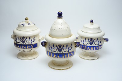 Lot 281 - Three pharmacy apothecary jars and covers