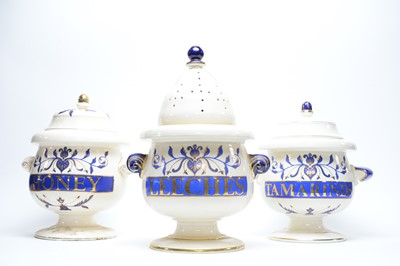 Lot 281 - Three pharmacy apothecary jars and covers