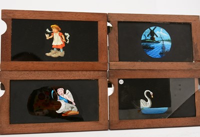 Lot 26 - A collection of early 20th Century handpainted mahogany framed lantern slides