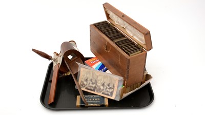 Lot 77 - An early 20th Century Stereoscope Viewer; together with sixteen boxes of stereoscope on film