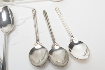 Lot 218 - A selection of silver teaspoons, sugar tongs and condiments and other items