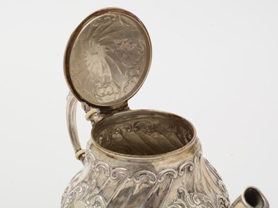 Lot 117 - A 20th Century German silver cream jug and covered sugar bowl; and a silver teapot