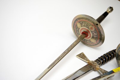 Lot 251 - Two enamelled fencing sabres; together with a presentation sword